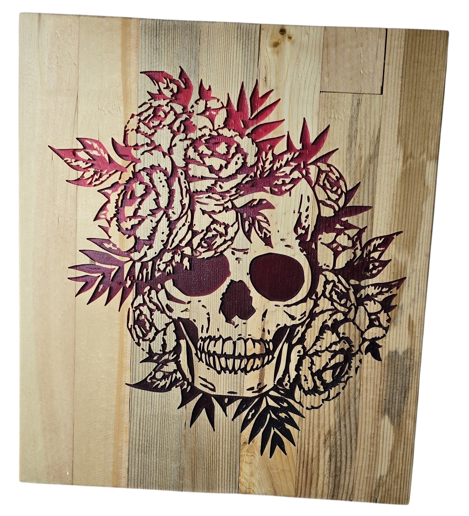 TK Wood Designs wooden wall art featuring a carved skull adorned with deep red roses and leaves.