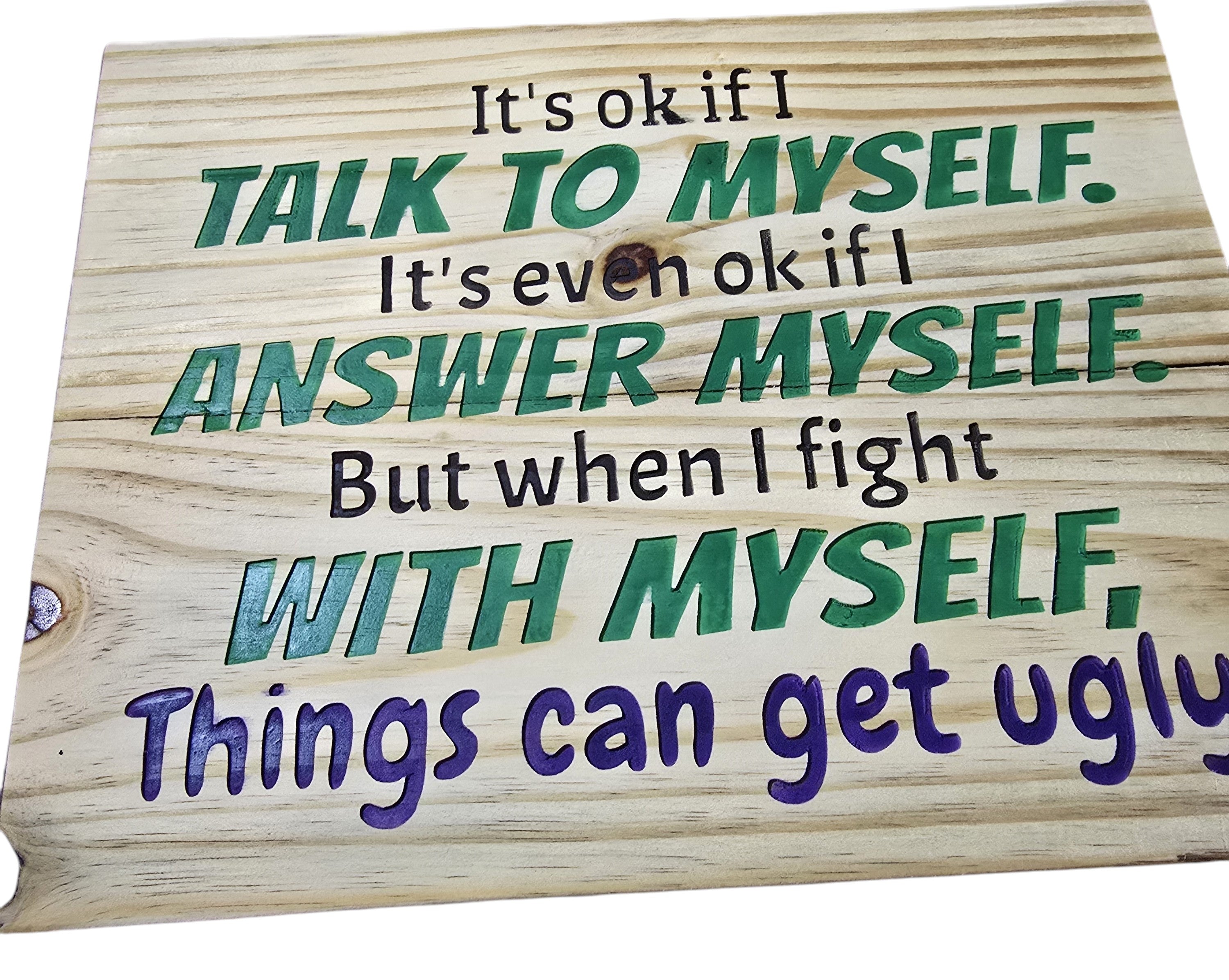 TK Wood Designs natural wood sign with carved text: "It's ok if I talk to myself. It's even ok if I answer myself. But when I fight with myself, Things can get ugly." Green and purple lettering.