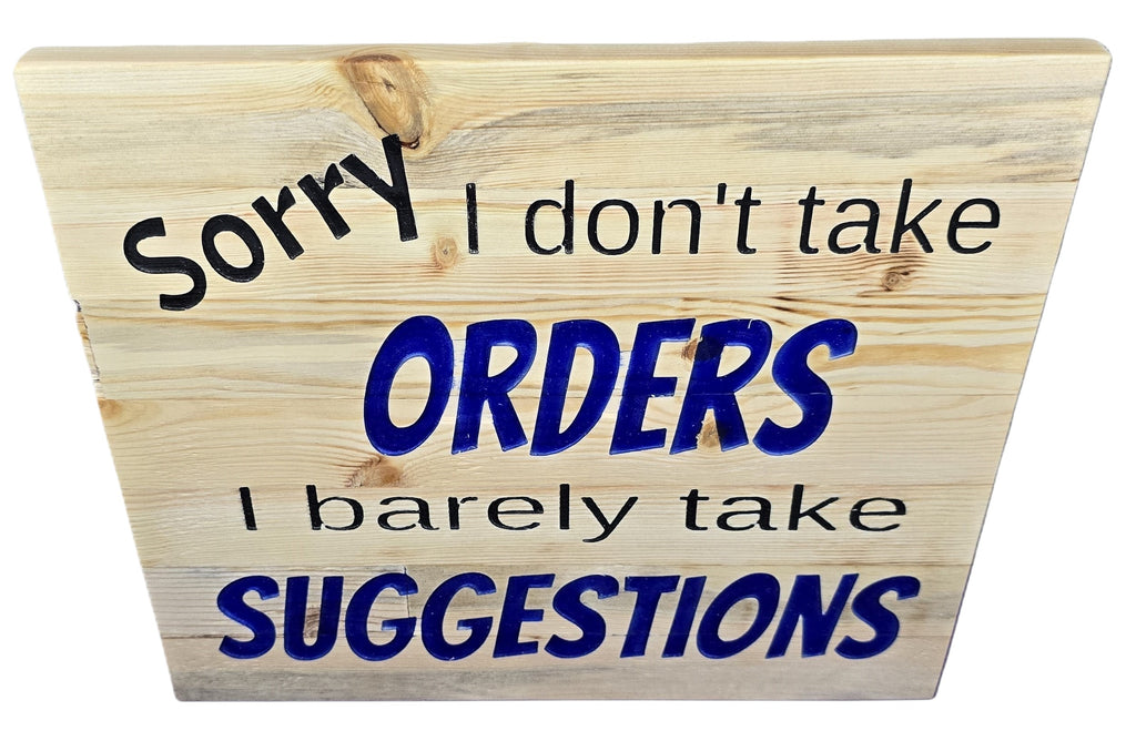 TK Wood Designs natural wood sign with black and blue text reading "Sorry I don't take ORDERS I barely take SUGGESTIONS".