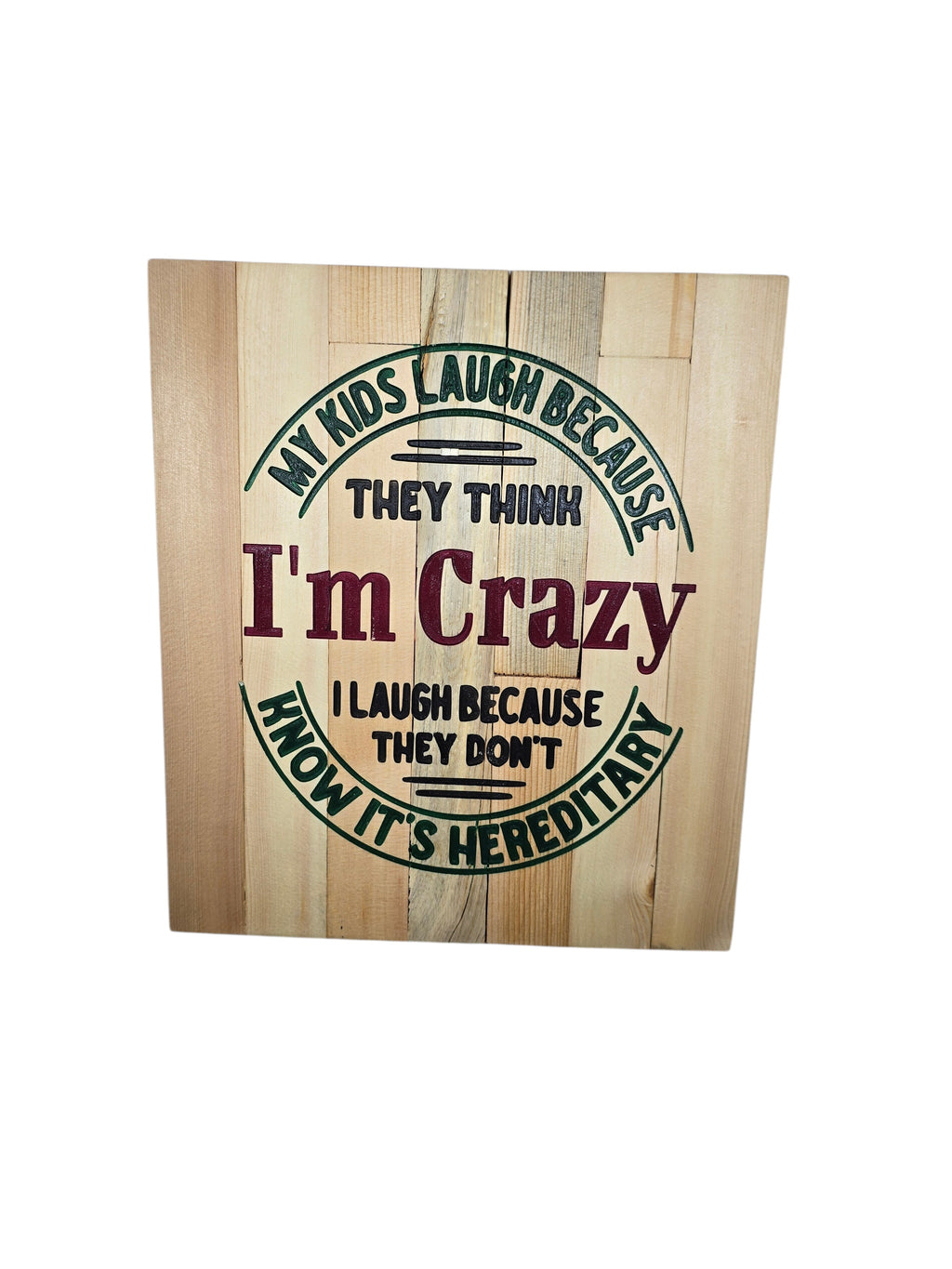 TK Wood Designs rustic wooden sign with text 'My kids laugh because they think I'm crazy. I laugh because they don't know it's hereditary.'