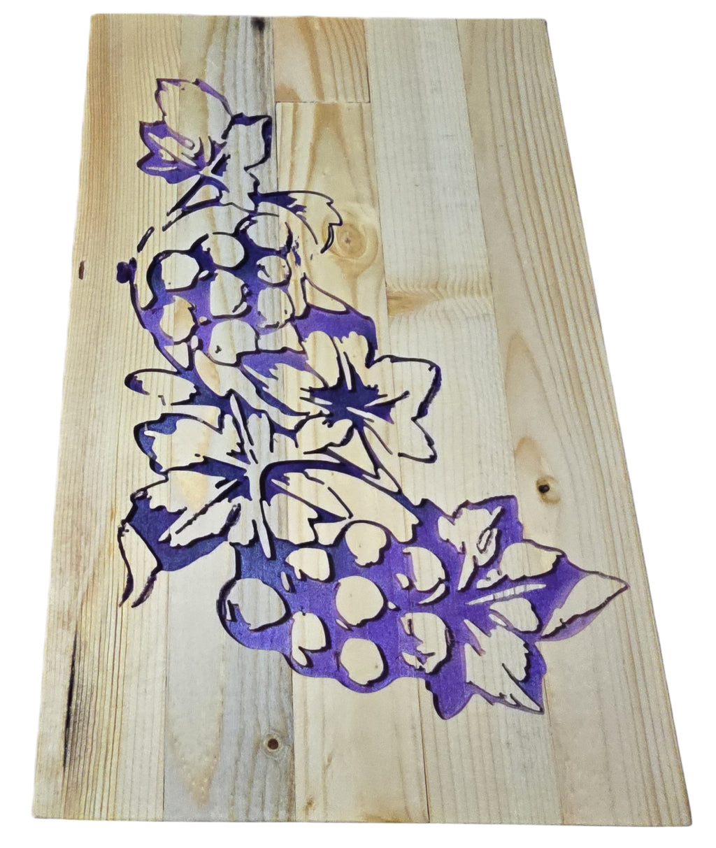 TK Wood Designs handcrafted wooden sign with carved purple grapes and leaves on a light wood plank background.