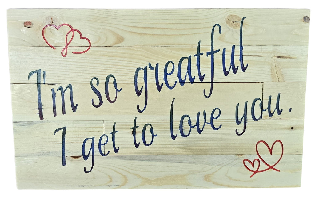 TK Wood Designs natural wood sign with navy blue script saying "I'm So Grateful I Get To Love You" and red heart accents.