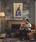 TK Wood Designs handcrafted wooden guitar sign with purple and blue carved forest scene. Natural wood grain.