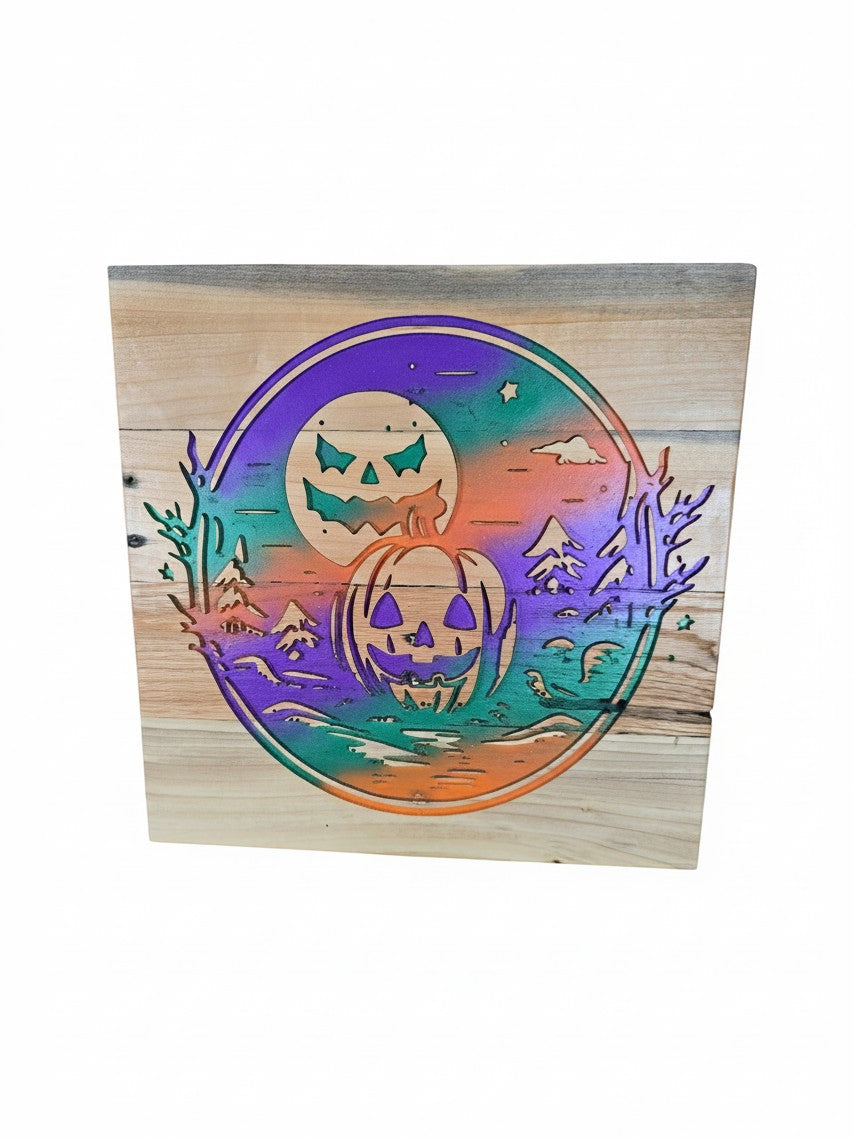 TK Wood Designs Halloween wooden sign featuring a laser-cut pumpkin and moon design with vibrant gradient colors.
