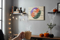 TK Wood Designs rustic plank wall art with a colorful laser-cut pumpkin and moon Halloween motif in a cozy room.