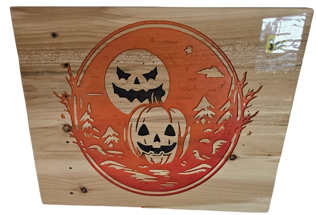 TK Wood Designs orange wood wall art with carved jack-o'-lanterns, moon, and trees. Halloween decor.