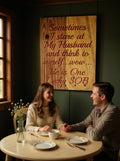 TK Wood Designs handcrafted wooden wall sign with a humorous quote hanging in a cozy dining room with a couple.