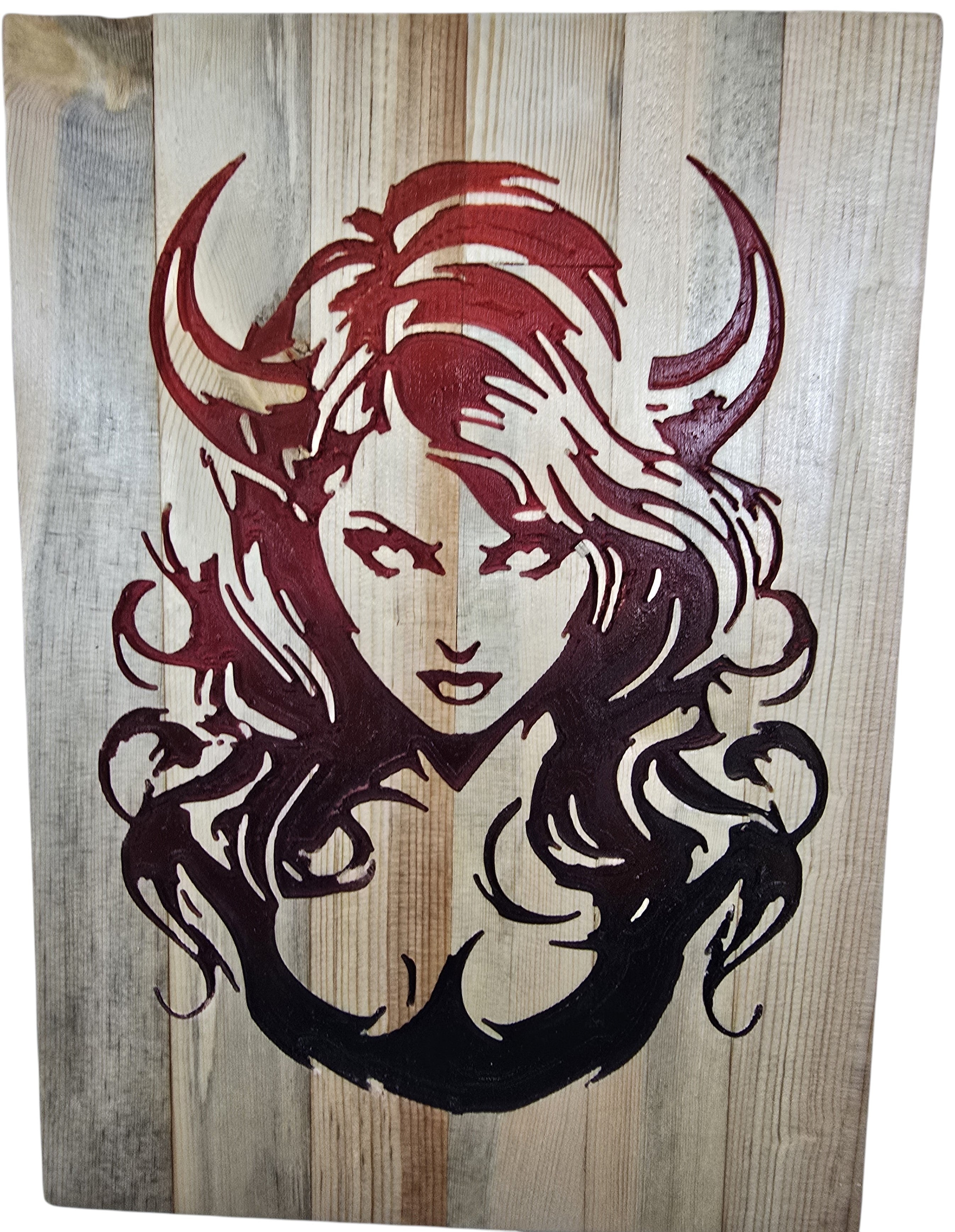 TK Wood Designs horned woman wood wall art in deep red and black on natural wood planks.