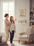 TK Wood Designs rustic wooden wall sign with humorous daughter quote hanging in a cozy living room with a mother and daughter.