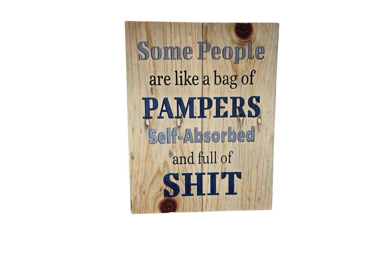 TK Wood Designs rustic wooden wall sign with humorous text about self-absorbed people in blue and black lettering.