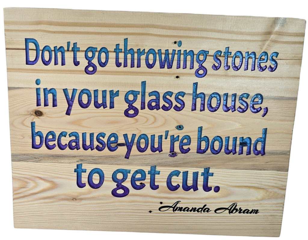 TK Wood Designs inspirational wood wall art with blue and purple quote "Don't go throwing stones in your glass house, because you're bound to get cut."