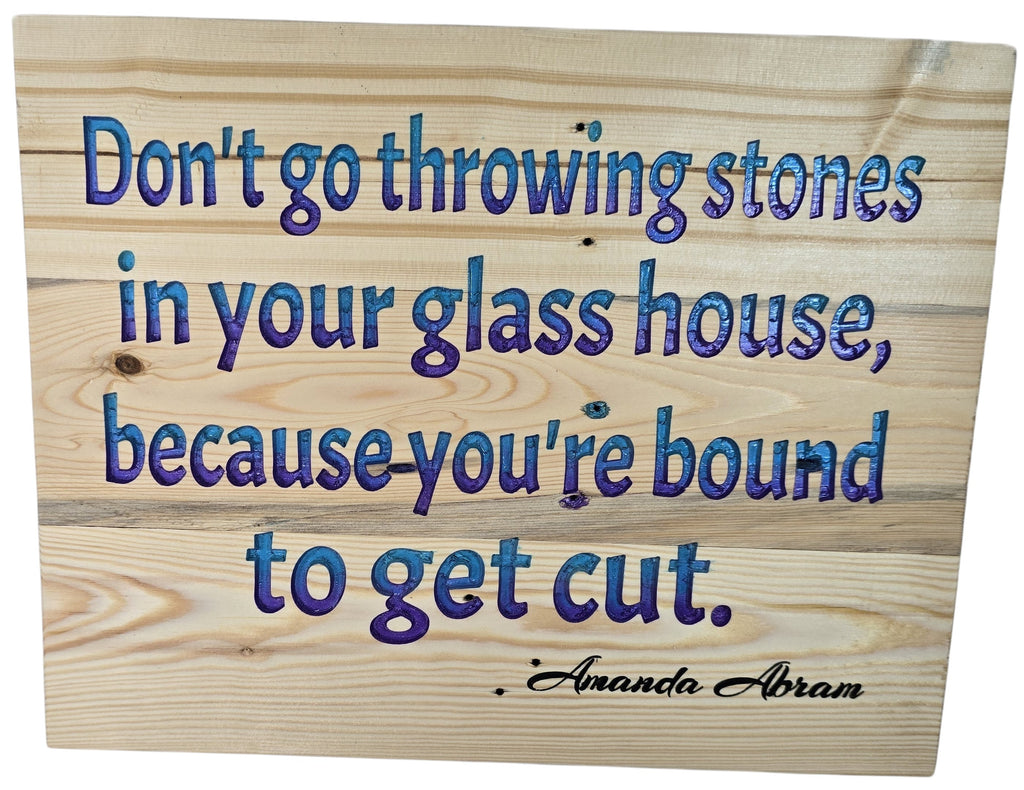 TK Wood Designs inspirational wood wall art with blue and purple quote "Don't go throwing stones in your glass house, because you're bound to get cut."