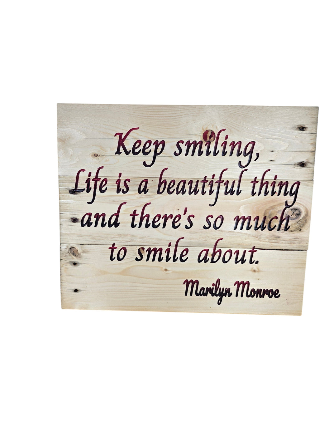 TK Wood Designs natural wood sign with "Keep smiling, Life is a beautiful thing and there's so much to smile about. Marilyn Monroe" in dark red script.