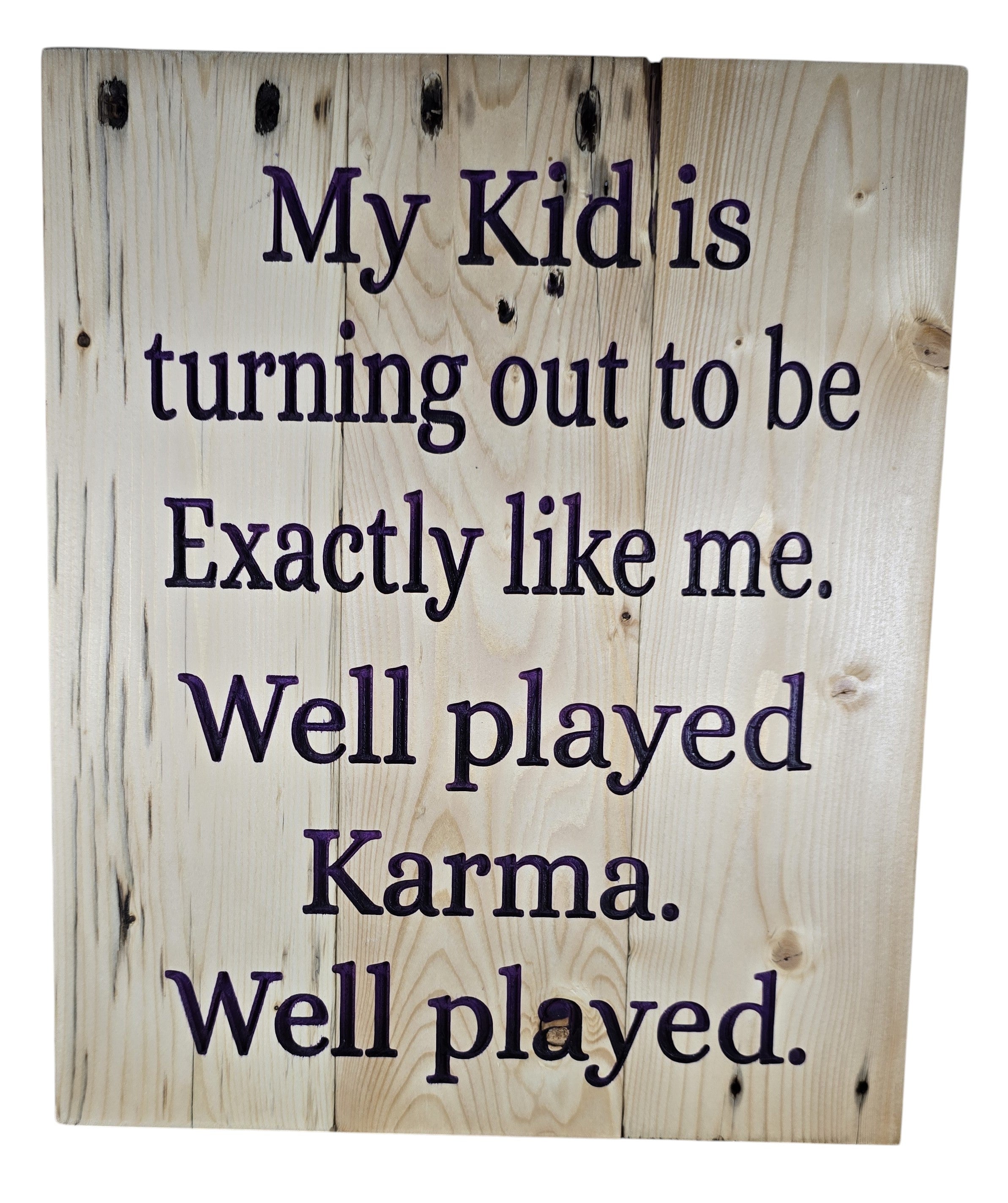 TK Wood Designs natural wood sign with dark purple text reading "My Kid is turning out to be Exactly like me. Well played Karma. Well played."