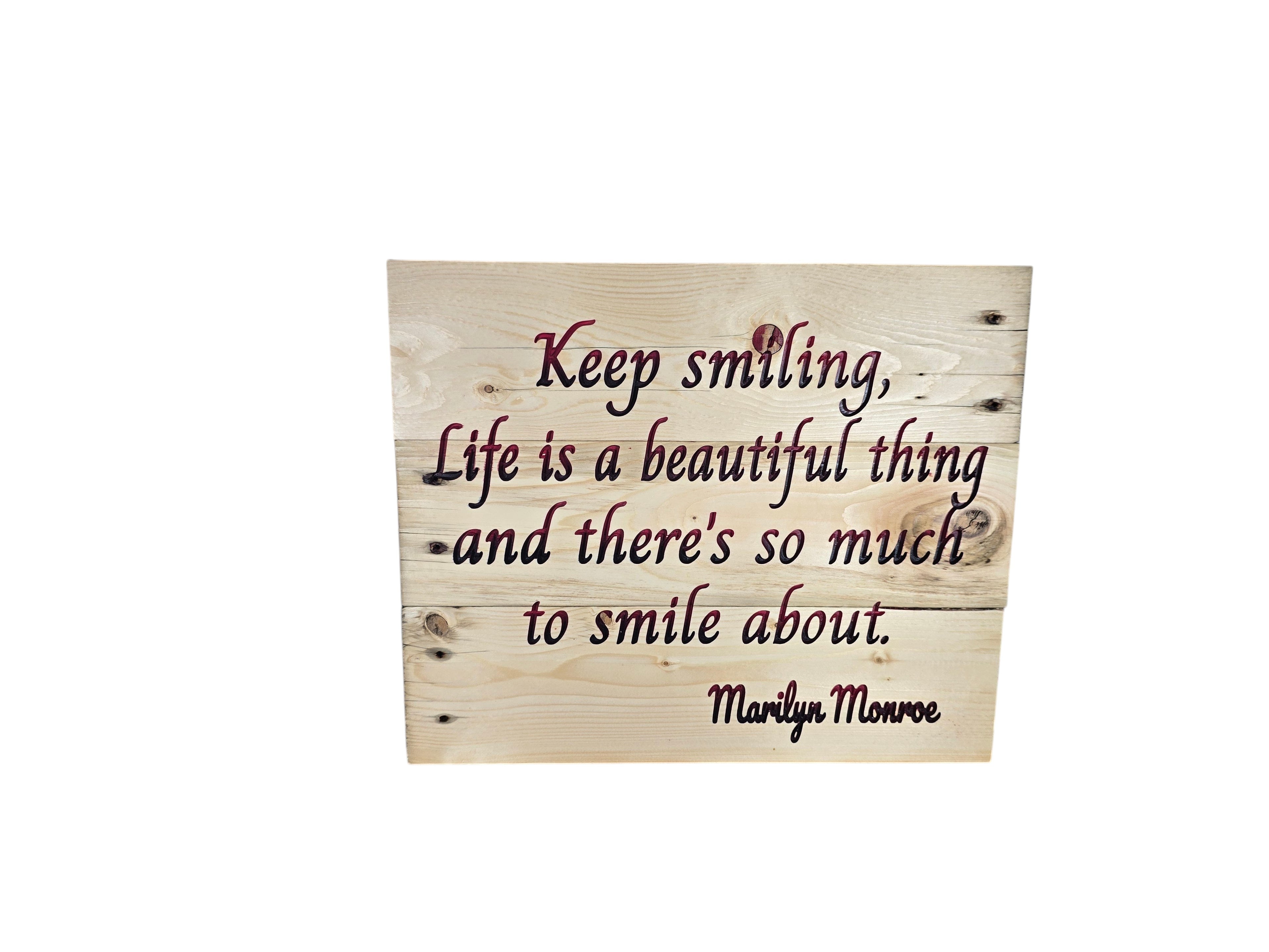 TK Wood Designs natural wood sign with "Keep smiling, Life is a beautiful thing and there's so much to smile about." quote in burgundy script.
