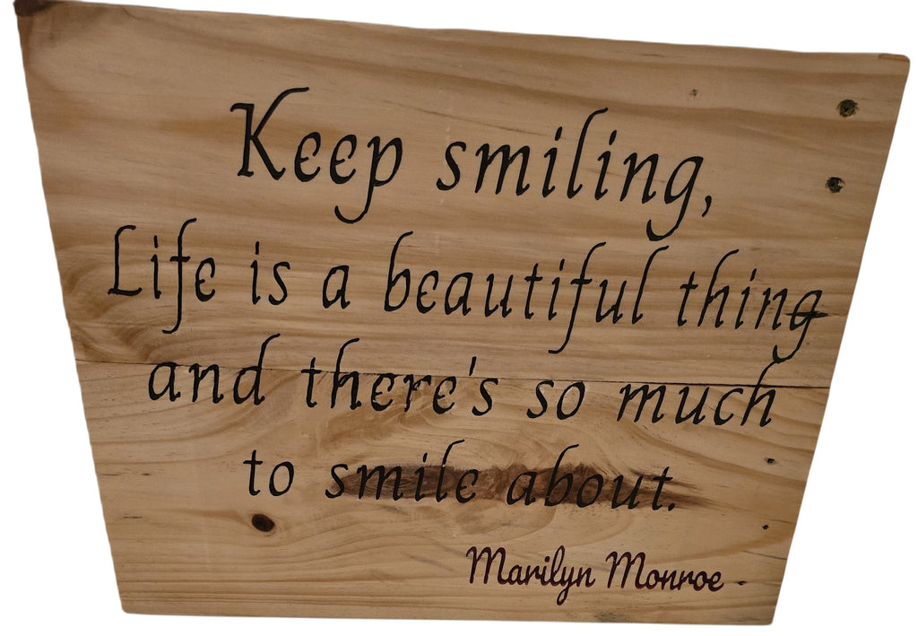 TK Wood Designs natural wood sign with carved lettering: "Keep smiling, Life is a beautiful thing and there's so much to smile about." - Marilyn Monroe.