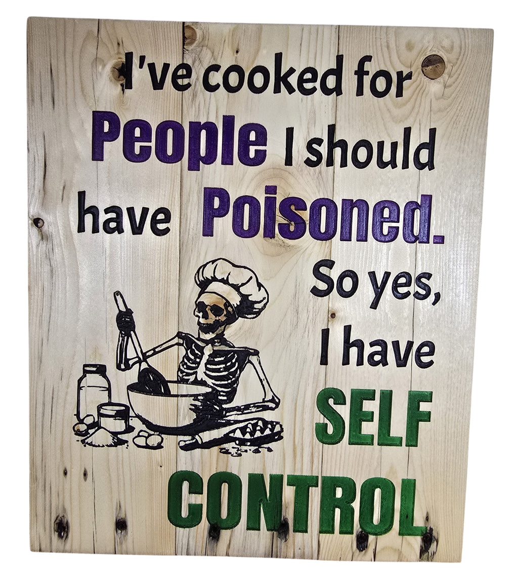 TK Wood Designs natural wood kitchen wall art with skeleton chef illustration and witty quote about self-control.