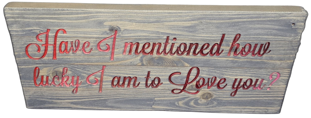 TK Wood Designs handcrafted wooden sign with red lettering reading "Have I mentioned how lucky I am to Love you?"
