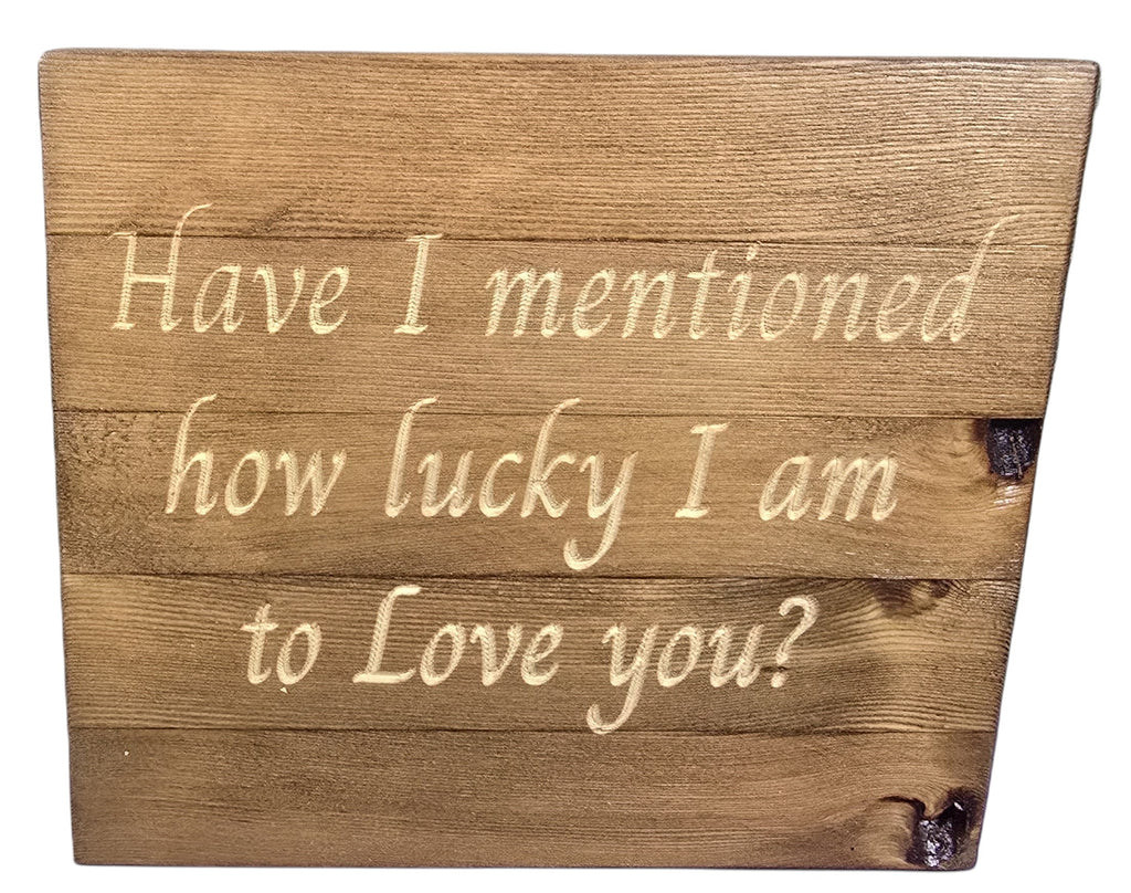 TK Wood Designs natural wood sign with carved text "Have I mentioned how lucky I am to Love you?" in a rustic finish.