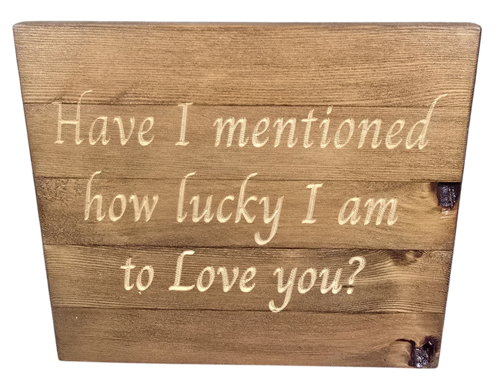 TK Wood Designs natural wood sign with carved text "Have I mentioned how lucky I am to Love you?" in script.