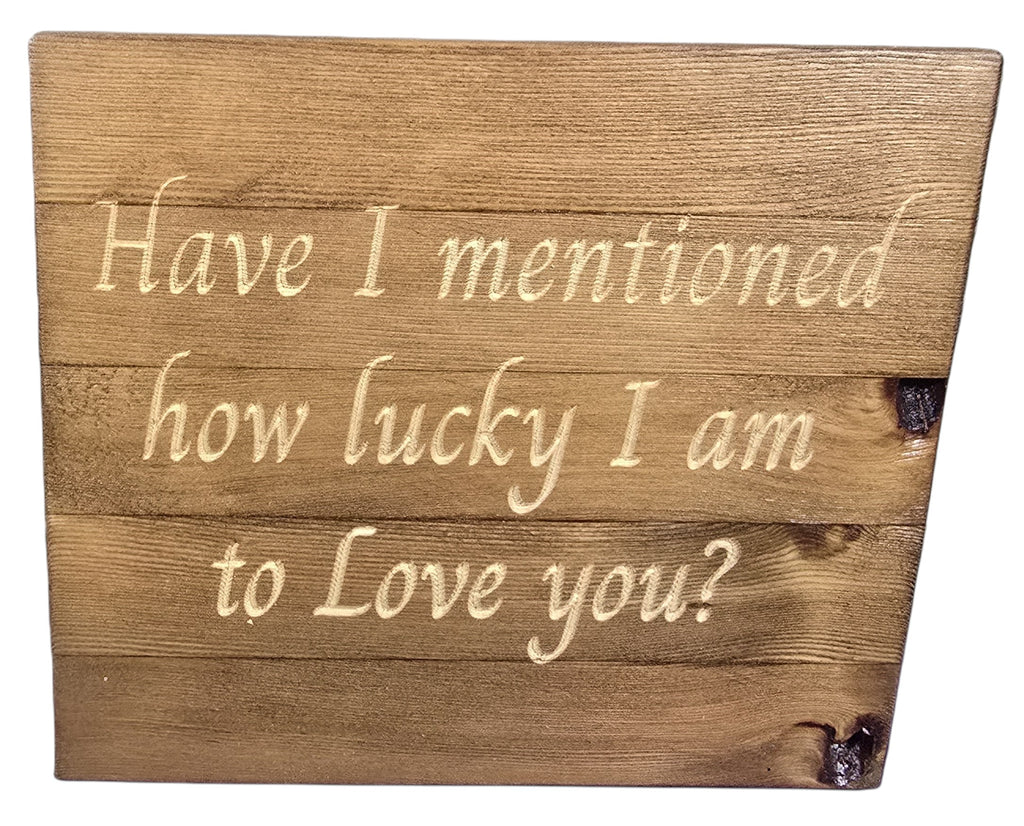 TK Wood Designs natural wood sign with carved text "Have I mentioned how lucky I am to Love you?" Rustic finish.