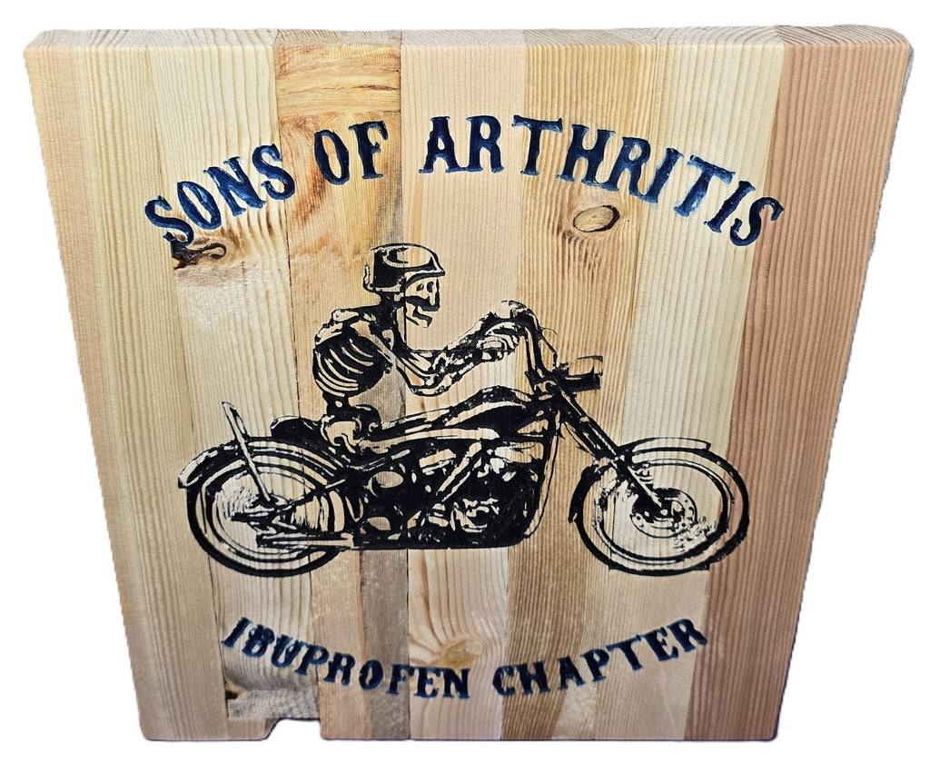 TK Wood Designs rustic wooden sign with skeleton biker graphic and "Sons of Arthritis Ibuprofen Chapter" text.