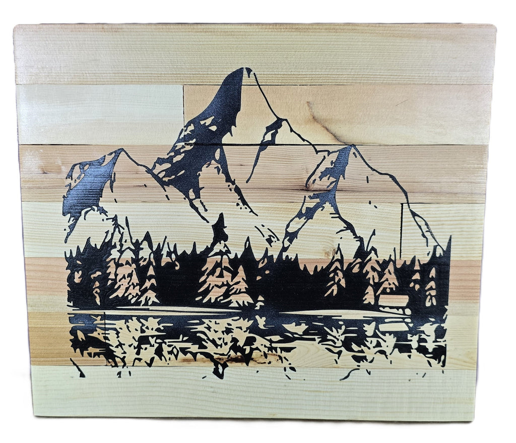 TK Wood Designs handcrafted reclaimed wood sign featuring a carved mountain landscape with pine trees and a lake reflection. Natural wood grain.