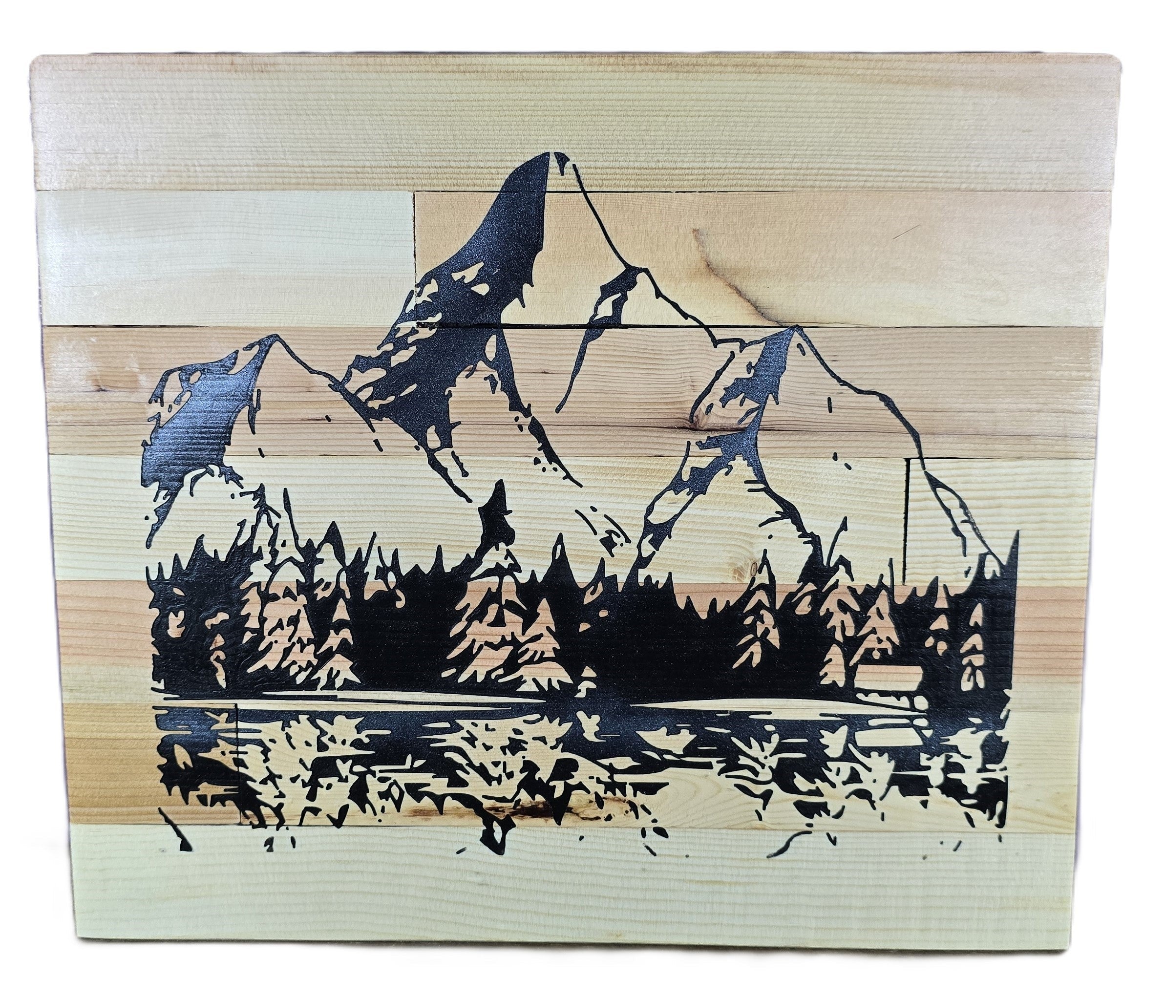 TK Wood Designs handcrafted reclaimed wood sign featuring a carved mountain landscape with pine trees and a lake reflection. Natural wood grain.