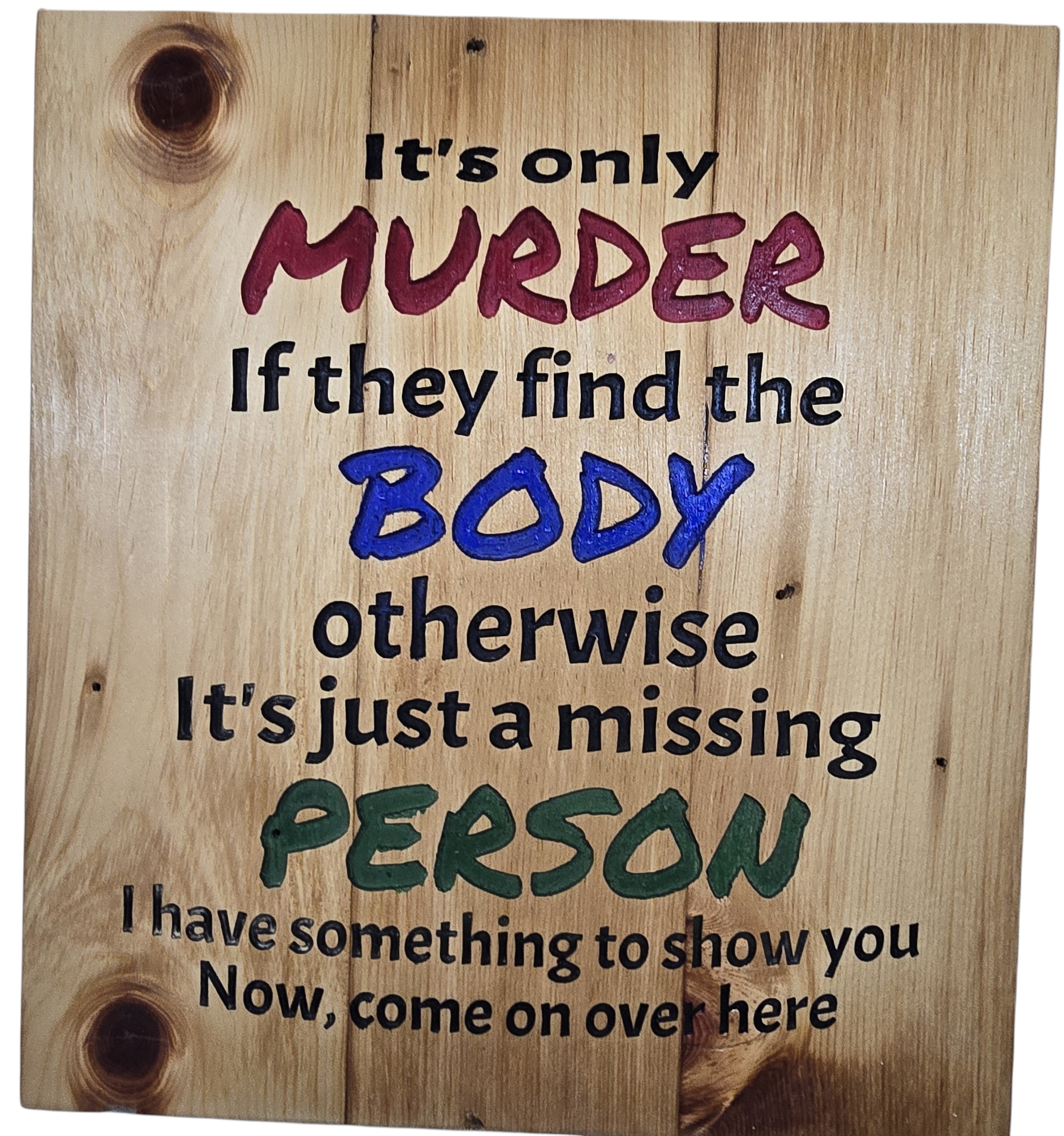 TK Wood Designs wooden sign with dark humor text: "It's only MURDER If they find the BODY otherwise It's just a missing PERSON".