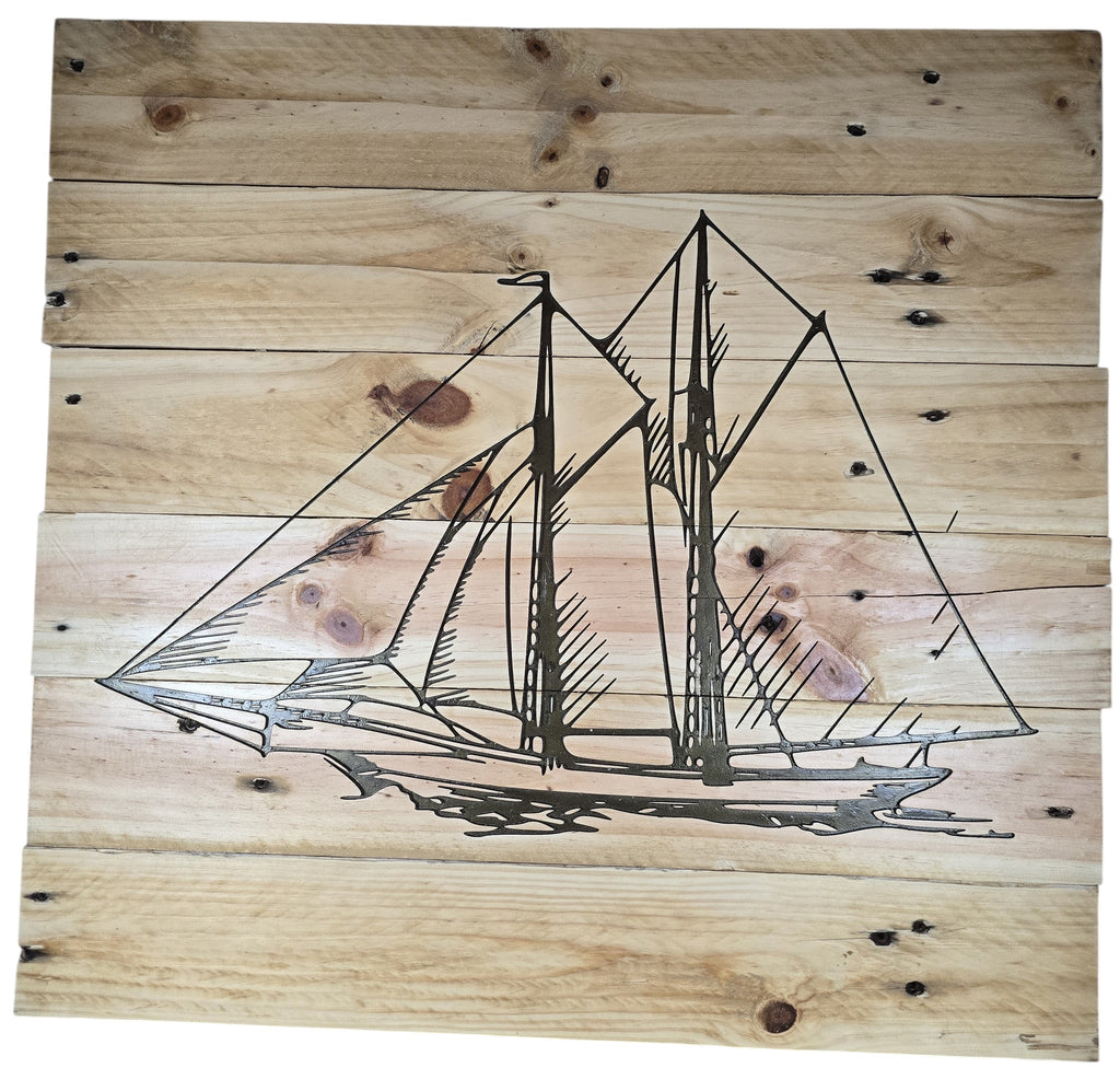 TK Wood Designs natural wood plank wall art featuring an etched sailboat design. Rustic maritime decor.