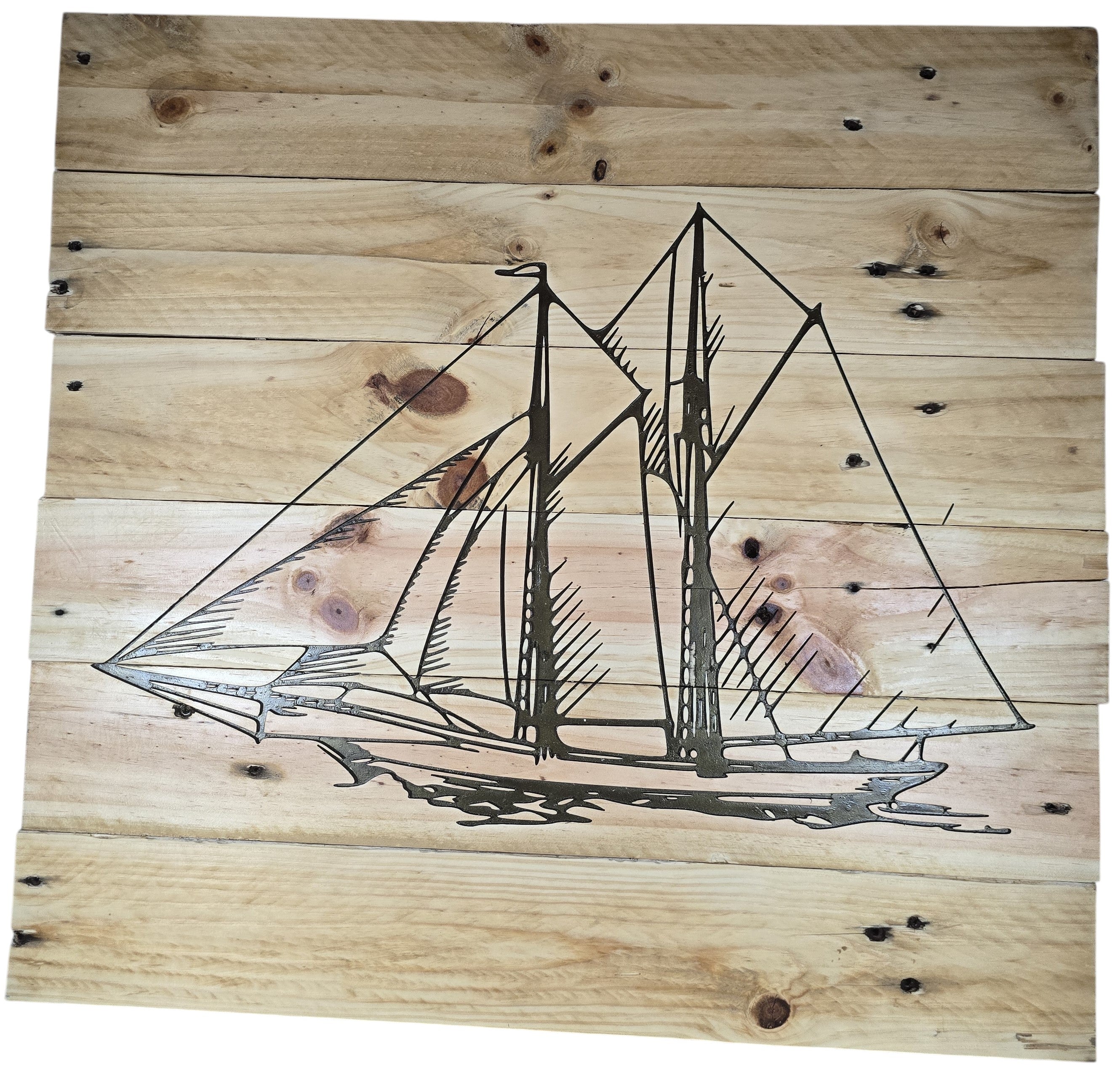TK Wood Designs natural wood wall art featuring an etched sailboat design. Rustic maritime decor.