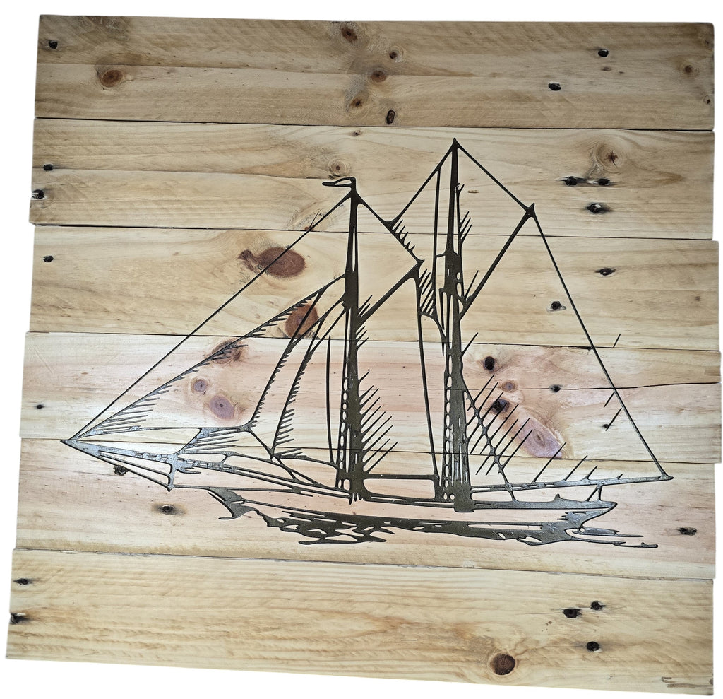 TK Wood Designs natural wood plank wall art featuring an etched sailboat design. Rustic maritime decor.