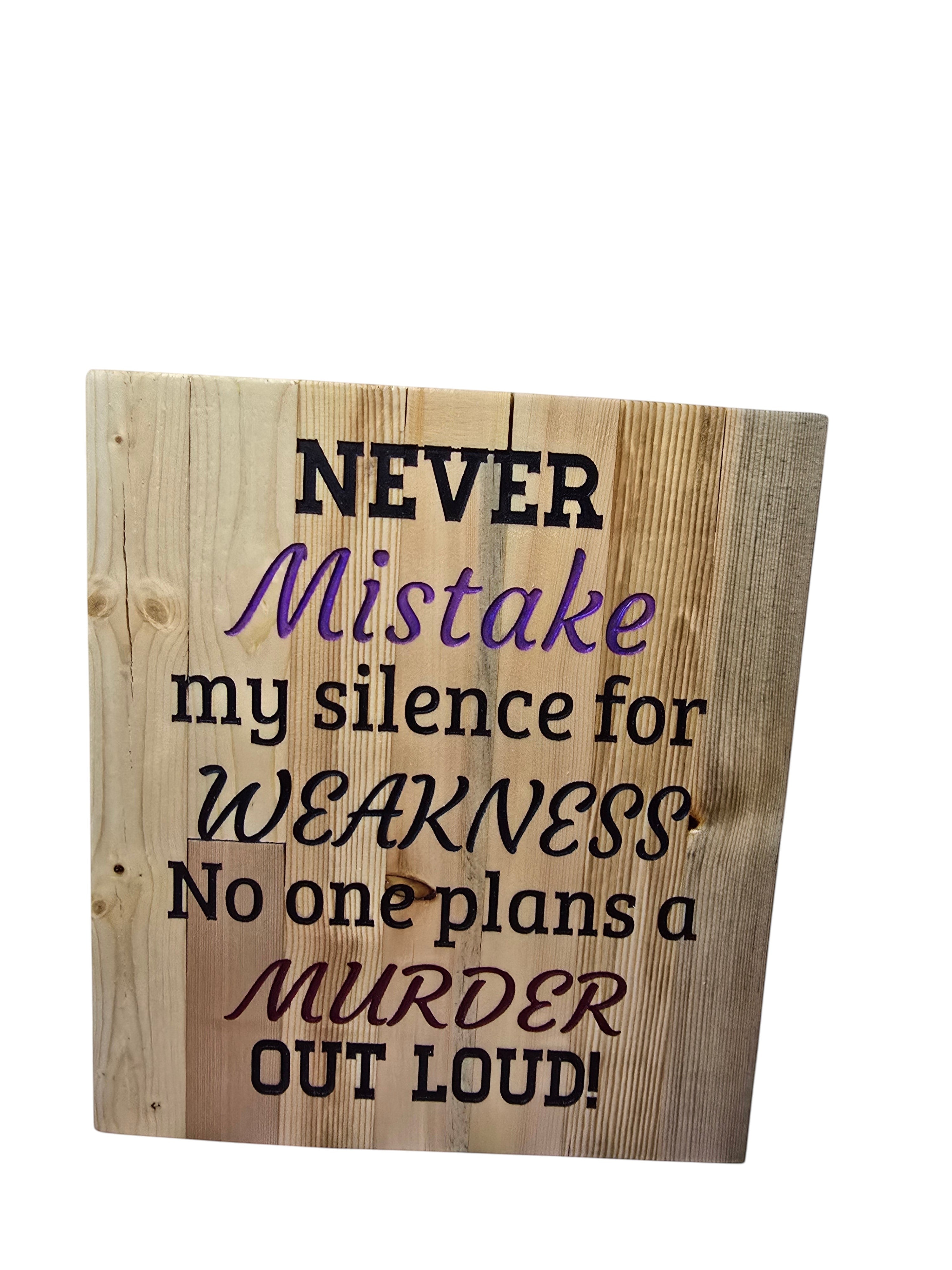 TK Wood Designs wooden sign with text "Never Mistake my silence for WEAKNESS No one plans a MURDER OUT LOUD!"