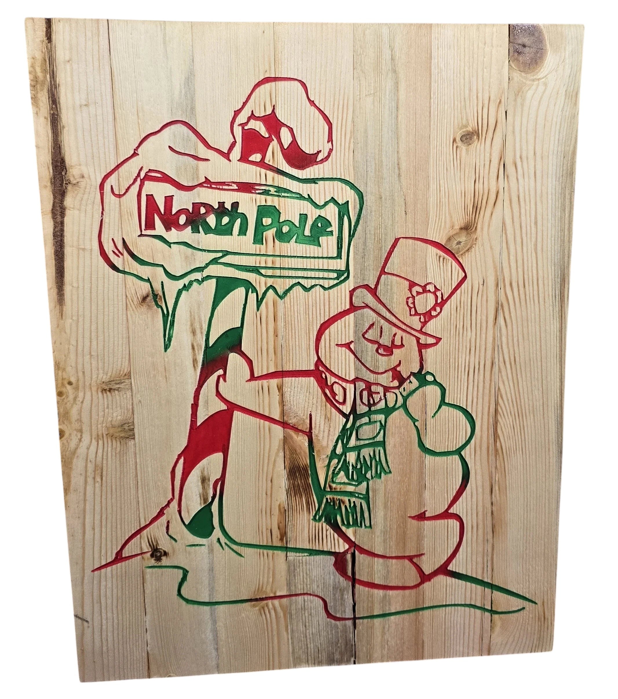 TK Wood Designs handmade rustic reclaimed wood sign with a red and green hand-painted North Pole sign and snowman. 15" H x 11.5" W.