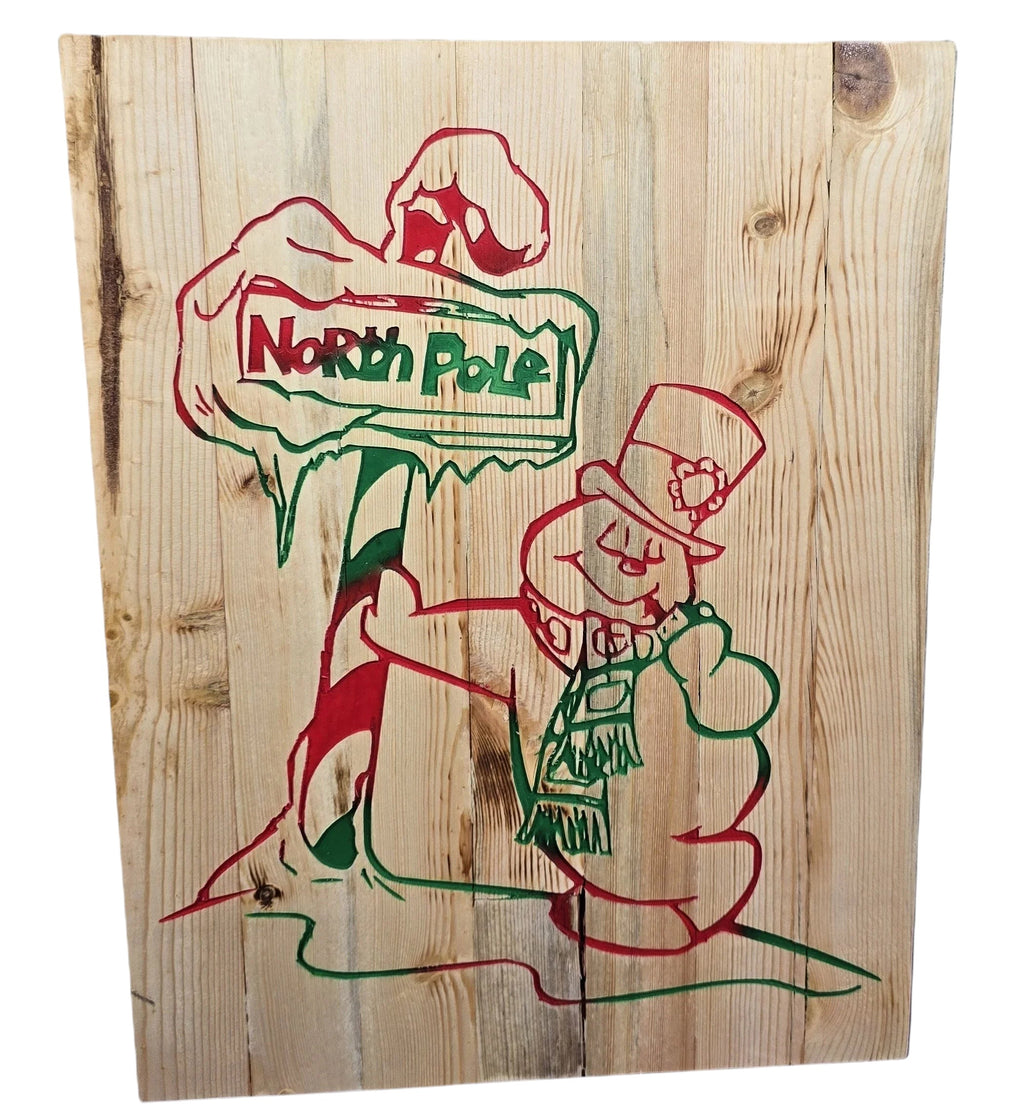 TK Wood Designs handmade rustic reclaimed wood sign with red and green North Pole text and snowman graphic.