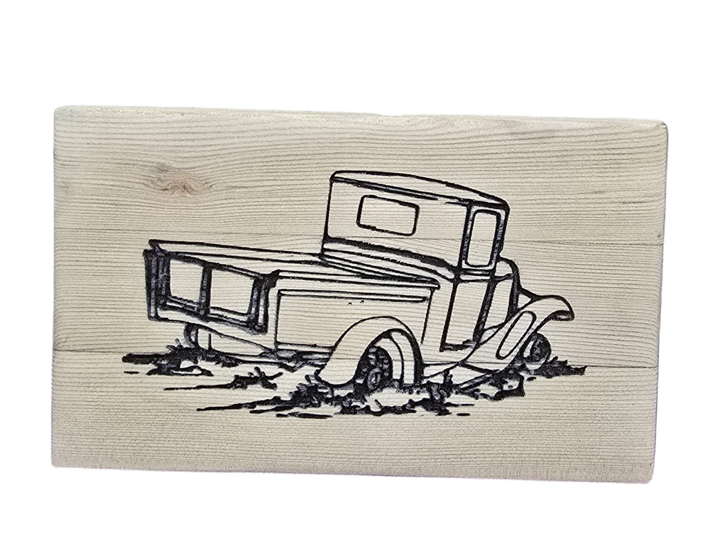 TK Wood Designs rustic reclaimed wood sign with a black line drawing of an old pickup truck stuck in mud.