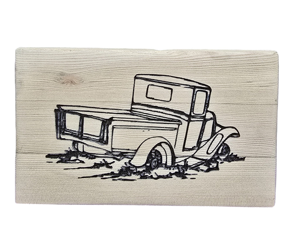 TK Wood Designs rustic reclaimed wood sign with a black line drawing of an old pickup truck stuck in mud.