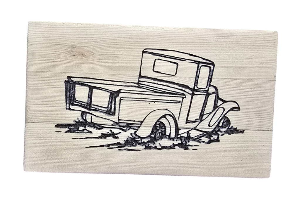 TK Wood Designs rustic reclaimed wood sign with a black line drawing of an old pickup truck stuck in mud.