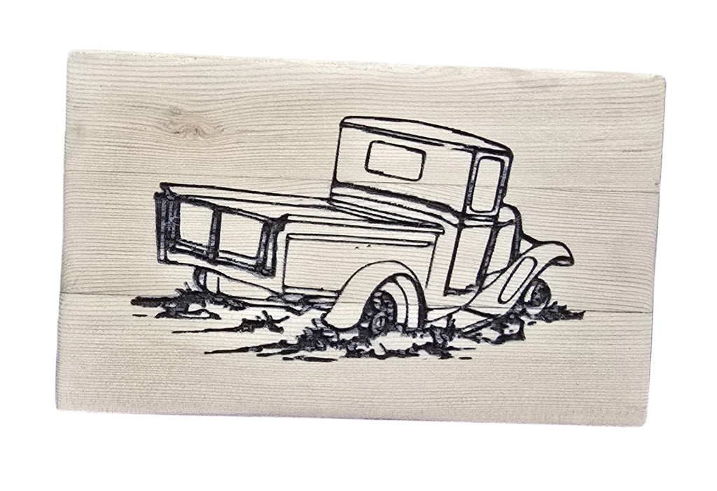 TK Wood Designs rustic reclaimed wood sign with a black line drawing of an old pickup truck stuck in mud.