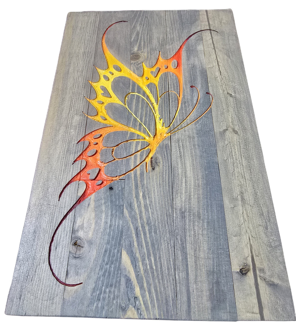 TK Wood Designs handmade salvaged wood butterfly decor, painted orange and yellow, with intricate wing details on a grey wood plank background.
