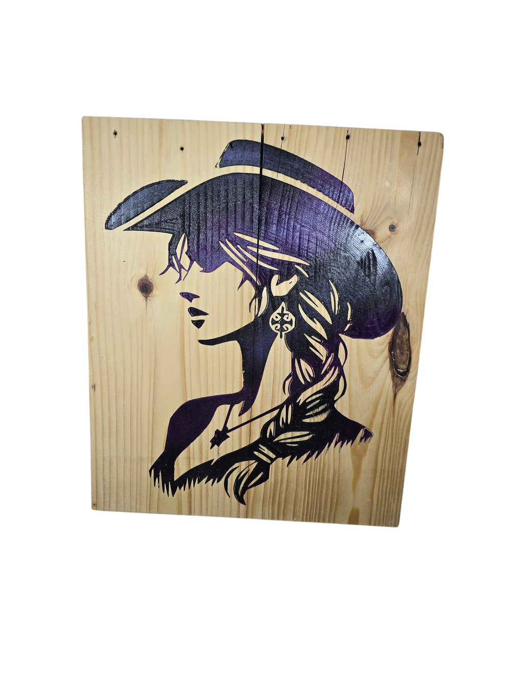 TK Wood Designs natural wood art with purple and black cowgirl silhouette, featuring a wide-brimmed hat and braided hair.