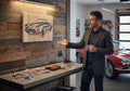 TK Wood Designs reclaimed wood sign featuring a carved black outline of a classic convertible car with a natural wood patina.