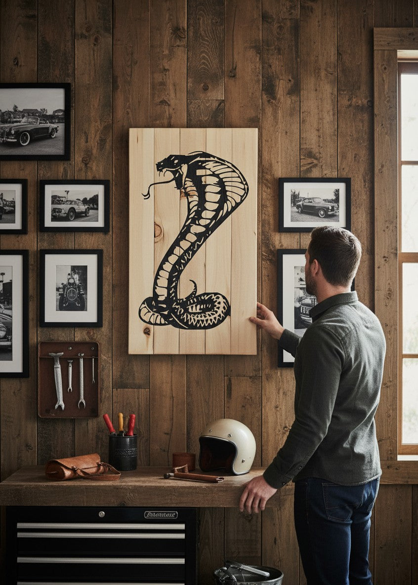 TK Wood Designs carved cobra sculpture from reclaimed wood, featuring a black cobra in a striking pose on a natural wood background.