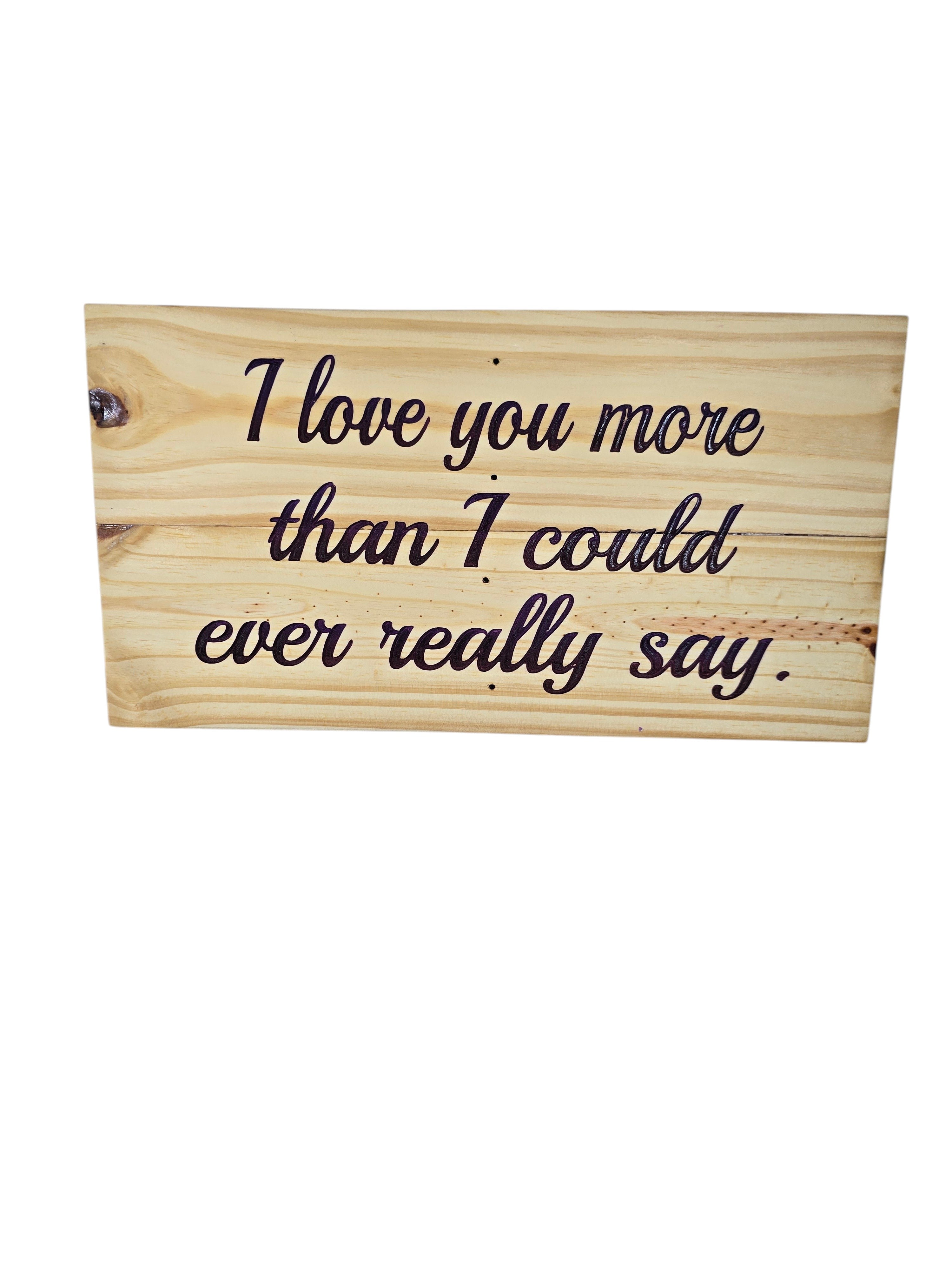 TK Wood Designs rustic reclaimed wood sign with hand-painted lettering that says "I love you more than I could ever really say."