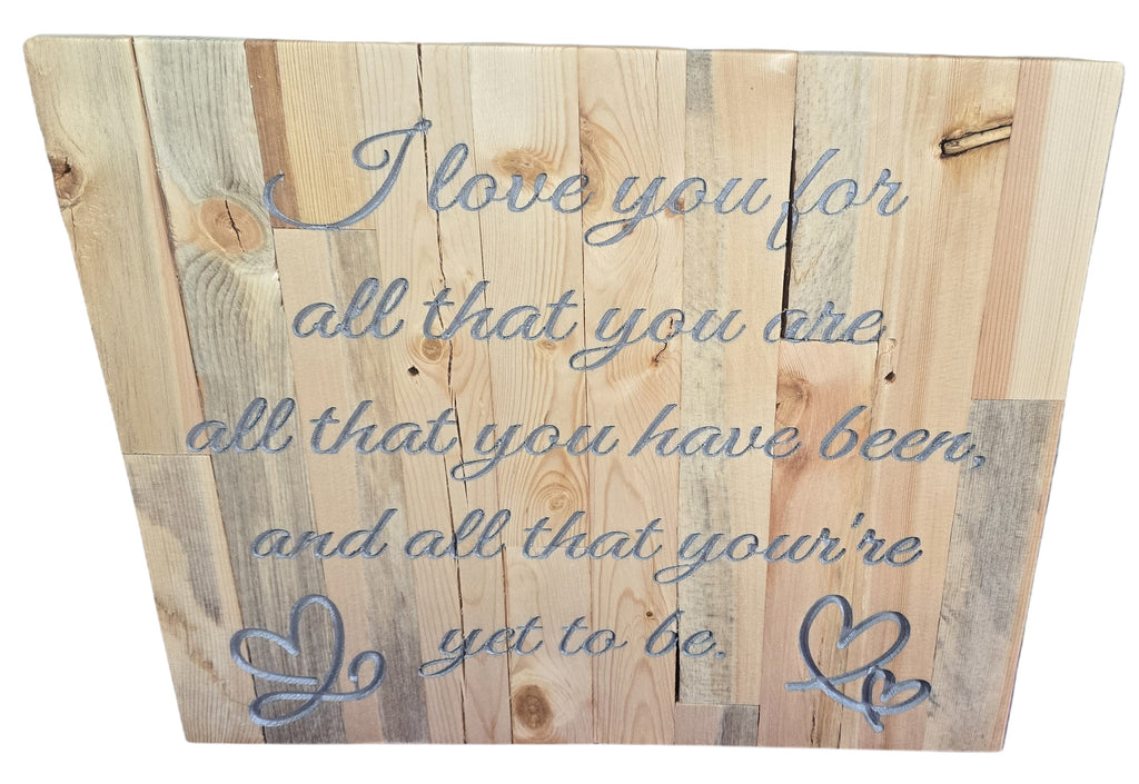 TK Wood Designs rustic reclaimed wood sign with engraved quote "I love you for all that you are, all that you have been, and all that you're yet to be." Features two intertwined hearts.