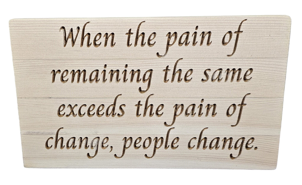 TK Wood Designs reclaimed wood sign with carved quote: "When the pain of remaining the same exceeds the pain of change, people change."