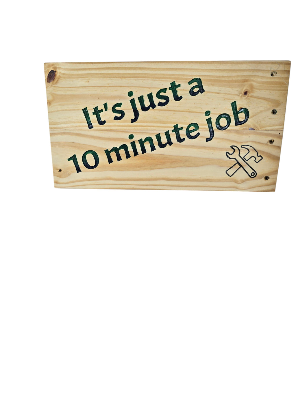 TK Wood Designs reclaimed wood sign with hand-painted text "It's just a 10 minute Job" and a wrench and hammer graphic.