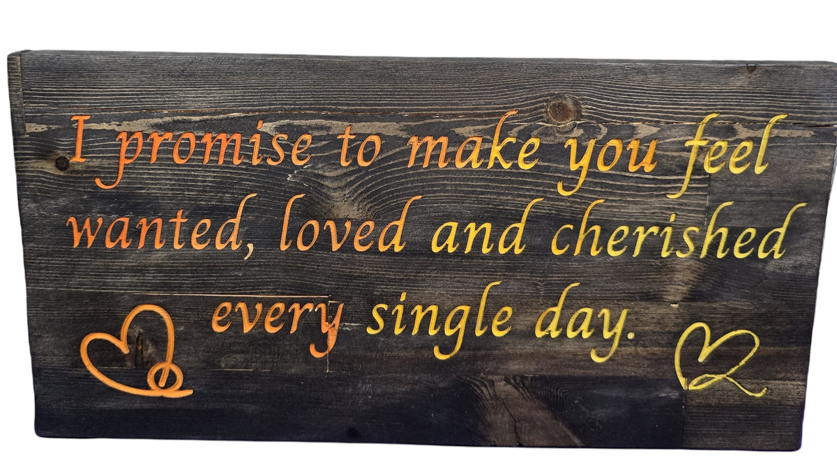 TK Wood Designs reclaimed wood sign with orange and yellow gradient text reading "I promise to make you feel wanted, loved and cherished every single day." with heart accents.