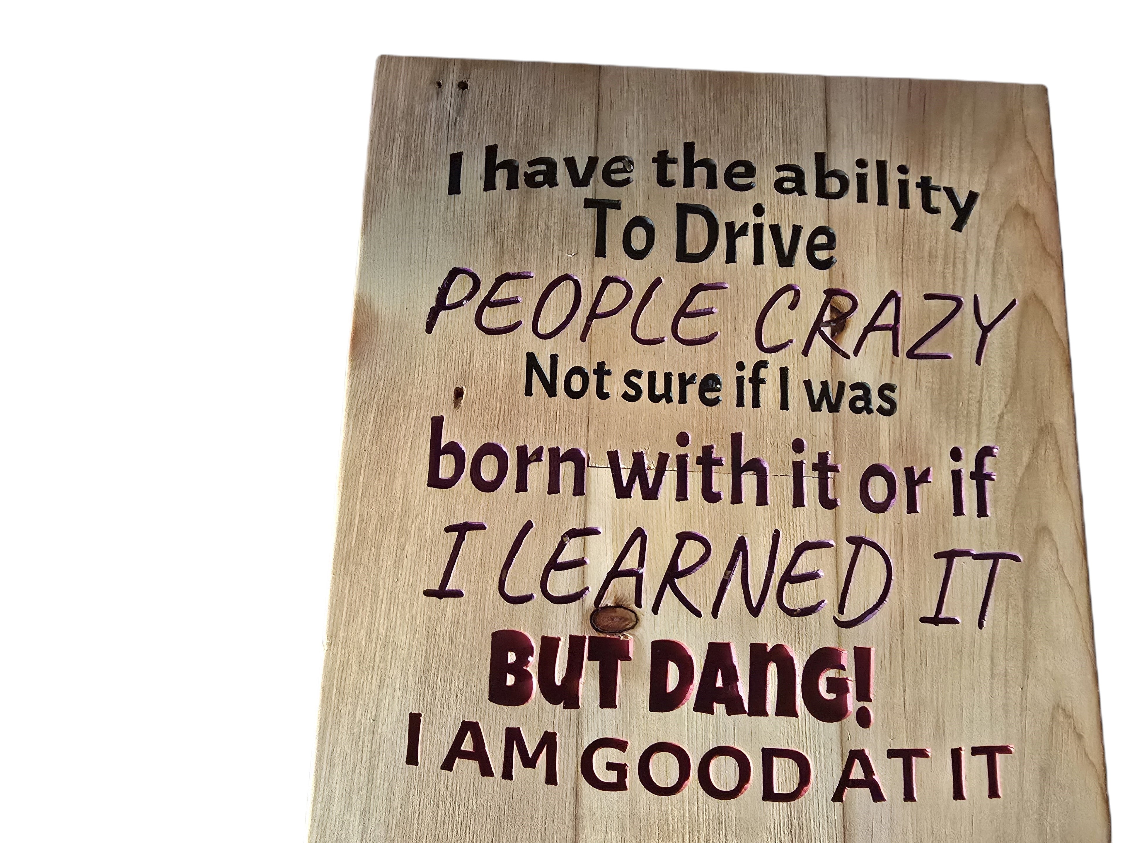 TK Wood Designs rustic reclaimed wood sign with carved text: "I have the ability to drive people crazy, not sure if I was born with it or if I learned it BUT DANG! I AM GOOD AT IT."