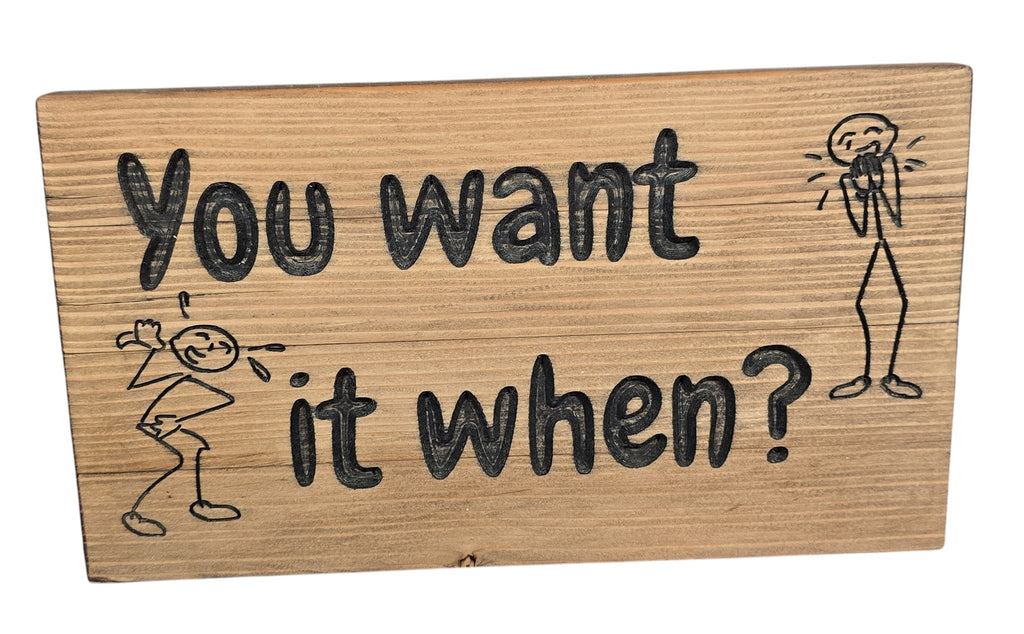 TK Wood Designs handmade reclaimed wood sign with witty hand-painted lettering "You want it when?" and stick figure illustrations.
